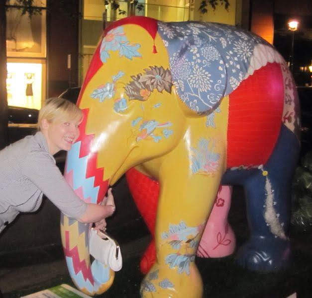 Helen's Journey Blog posing with a colourful elephant statue